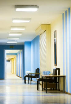 Corridor in an Eastern hospital. The walls are blue and yellow and were painted by Peintre Magog