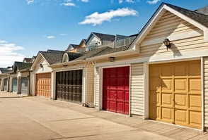 Several garage doors painted in bright colours in Magog